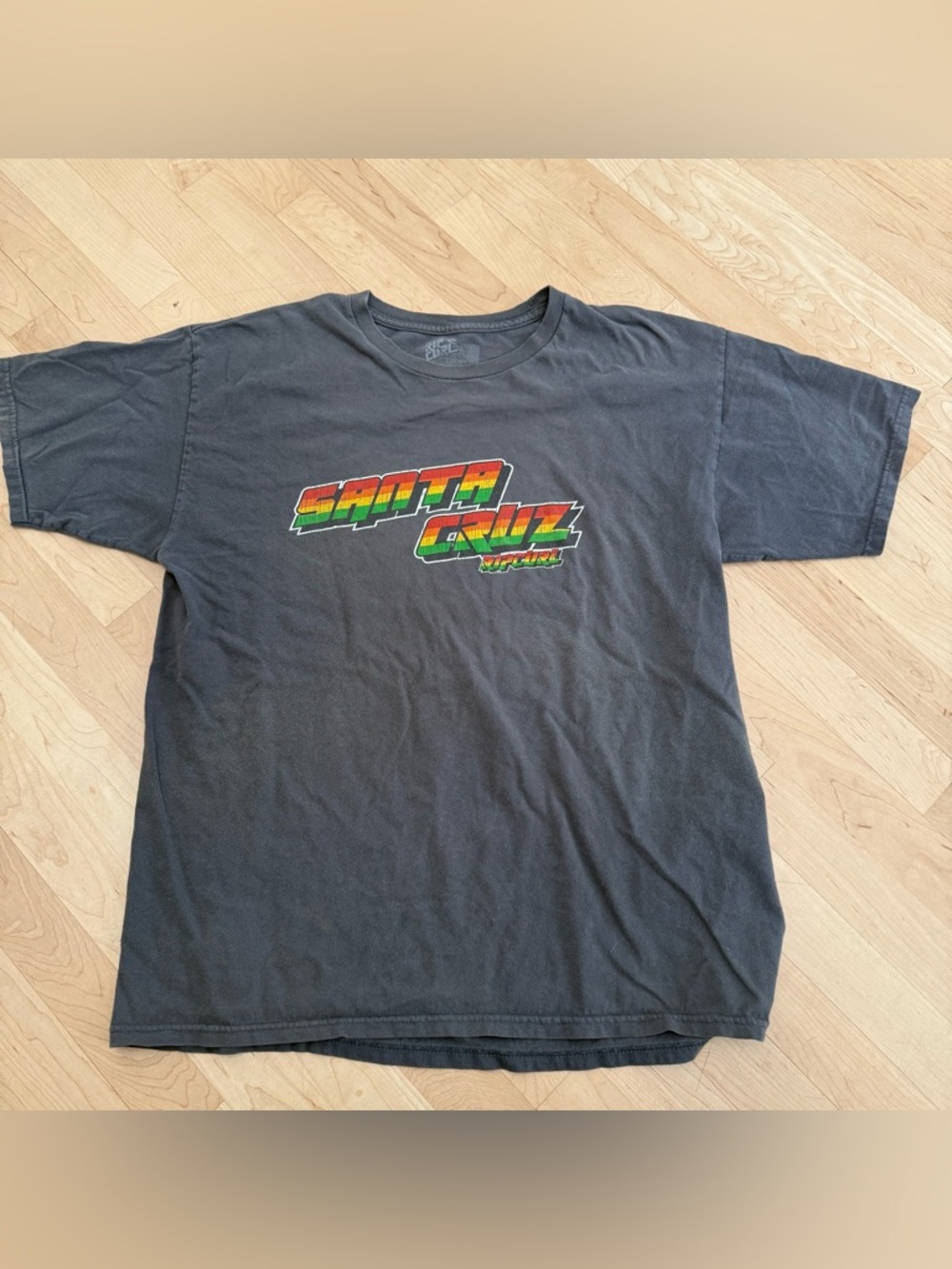 Rip Curl Black Short-Sleeve Tee with Red-Yellow-Green Graphic